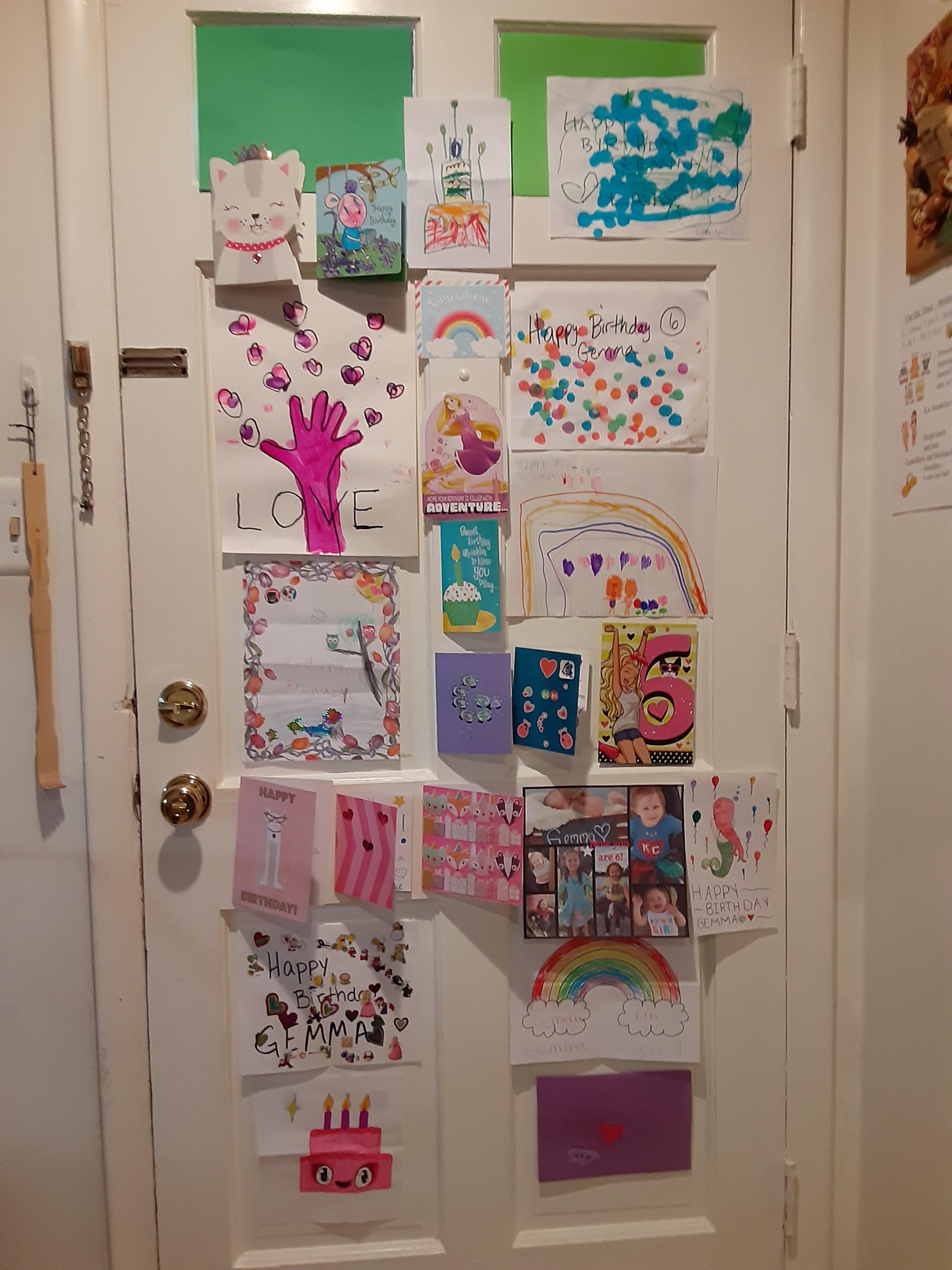 front door covered with birthday cards for Gemma